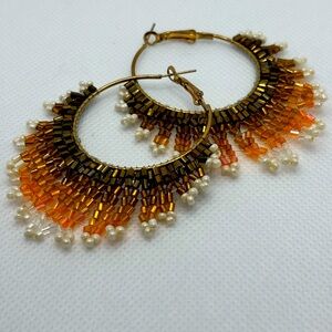 Brown, orange and gold beaded hoop earrings. Handmade